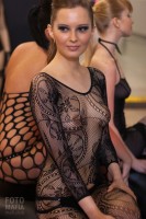 Девушка в эротическом наряде на выставке X'show 2011